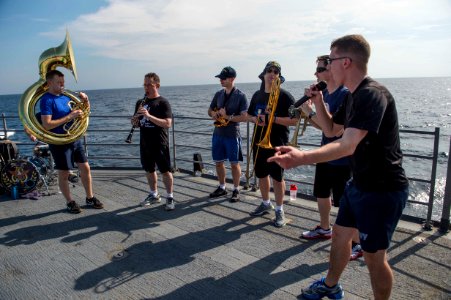 C7F Band puts on a show aboard USS Antietam enroute to the International Fleet Review 160131-N-ZZ786-234