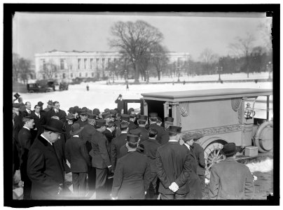 CAPITOL, U.S. VISITORS, ETC. CASKET BEING PLACED IN HEARSE LCCN2016865243