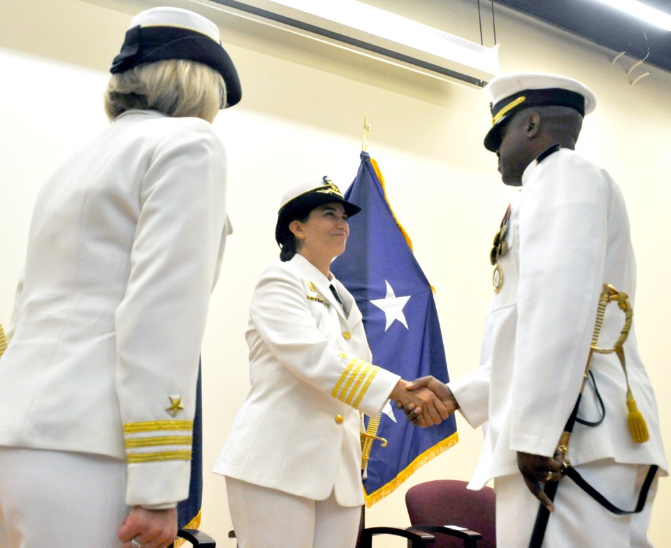 Capt McNinch congratulates Cmdr. Briggs