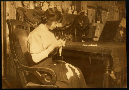 Celina Anzalone, 2264 First Ave., making lace for Cappallino's factory, near by. She said she was doing it only until Christmas. LOC cph.3b39333