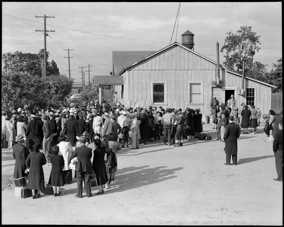 Centerville, California. Members of farm families await evacuation bus. Farmers and other evacuee . . . - NARA - 537578