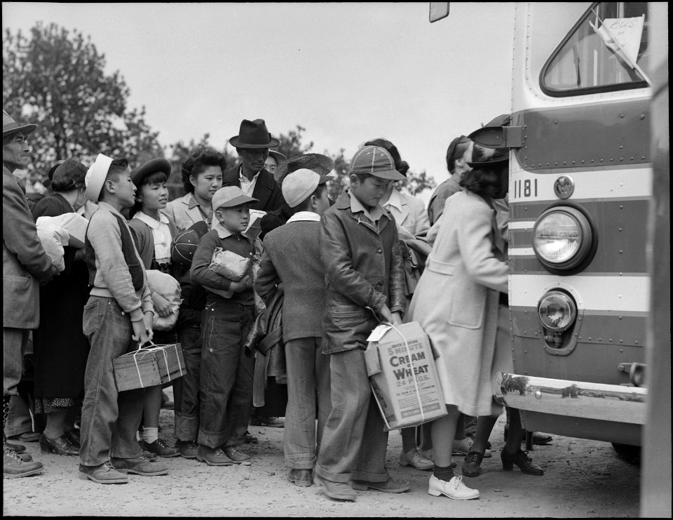 Centerville, California. Members of farm family board evacuation bus. Evacuees of Japanese ancestr . . . - NARA - 537584