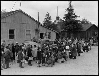 Centerville, California. Members of farm families await evacuation bus. Farmers and other evacuees . . . - NARA - 537574