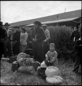 Centerville, California. A farming family awaits evacuation bus. Farmers an other evacuees of Japa . . . - NARA - 537567 photo