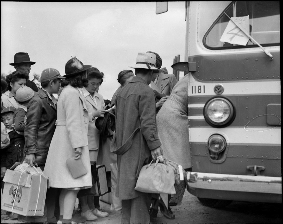 Centerville, California. The bus has just arrived and these farm families of Japanese ancestry are . . . - NARA - 537587