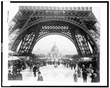 Central Dome and the Fountain Coutan seen through the base of the Eiffel Tower, with crowd on the Champ de Mars, Paris Exposition, 1889 LCCN92519768 photo