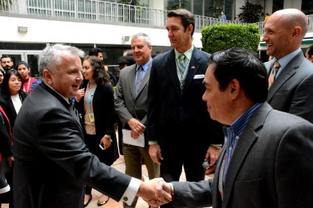 Deputy Secretary Sullivan Shakes Hands With Embassy Staff During a Meet and Greet