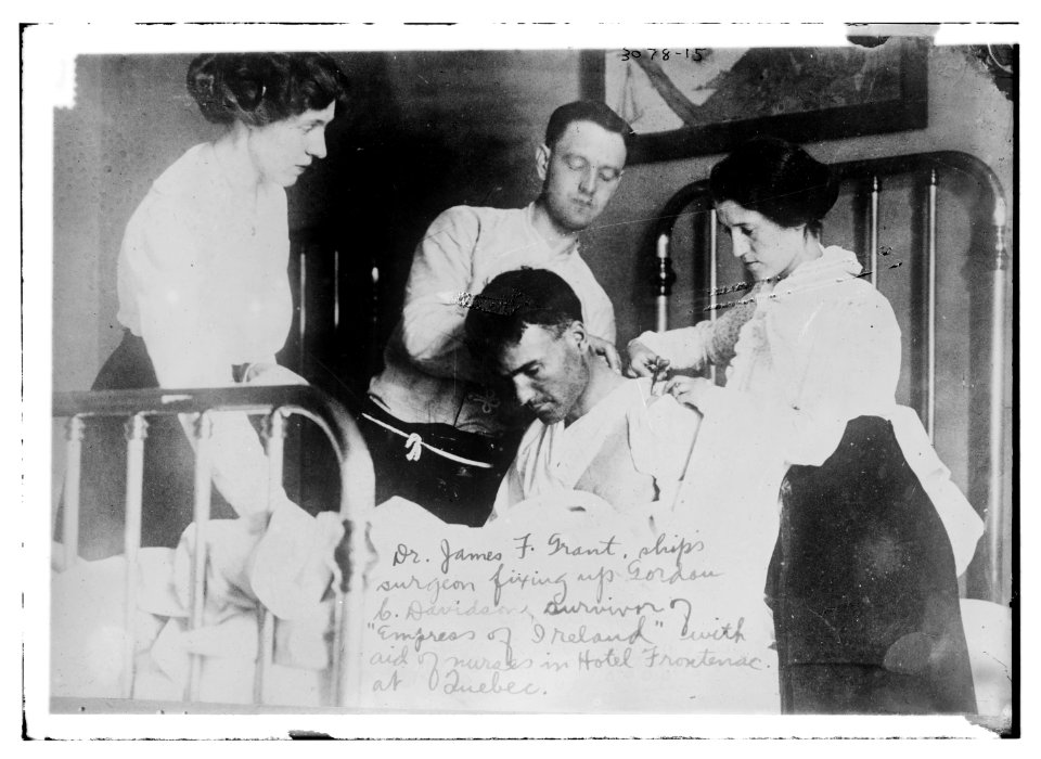 Dr. James F. Grant, ship's surgeon, fixing up Gordon G. Davidson, survivor of EMPRESS OF IRELAND, in Hotel Frontenac at Quebec LCCN2014696146