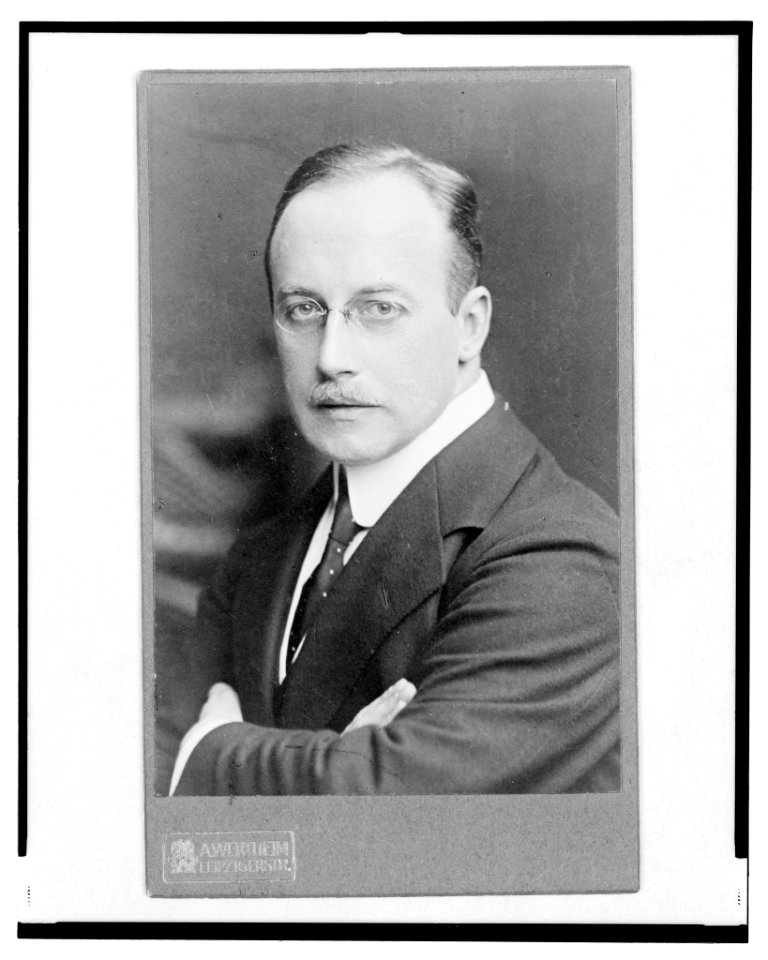 Dr. Jos. Fischer, half-length portrait, arms crossed over chest, facing left) - A. Wertheim, Leipzigerstr LCCN2004682543