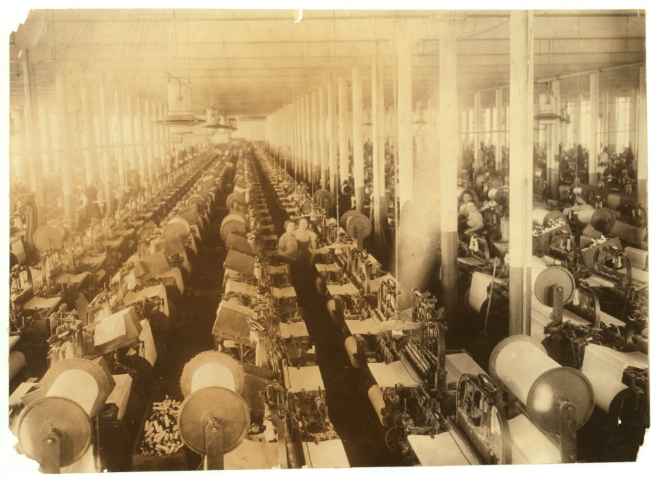 General view of weave room, Cornell Mill. Immediately after the photo was taken, the looms started up with deafening clatter. Cornell Mill. LOC nclc.02496