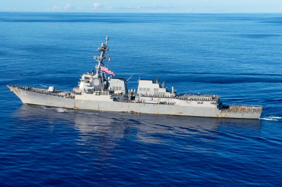 General view of USS Mustin (DDG-89) with sailors manning rails near Guam 2015 US Navy 150726-N-ZZ786-345