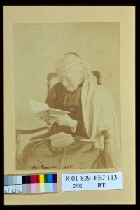Elderly woman seated and reading a book with knitting in her lap) - H.L. Bundy, 1895 LCCN2004676226
