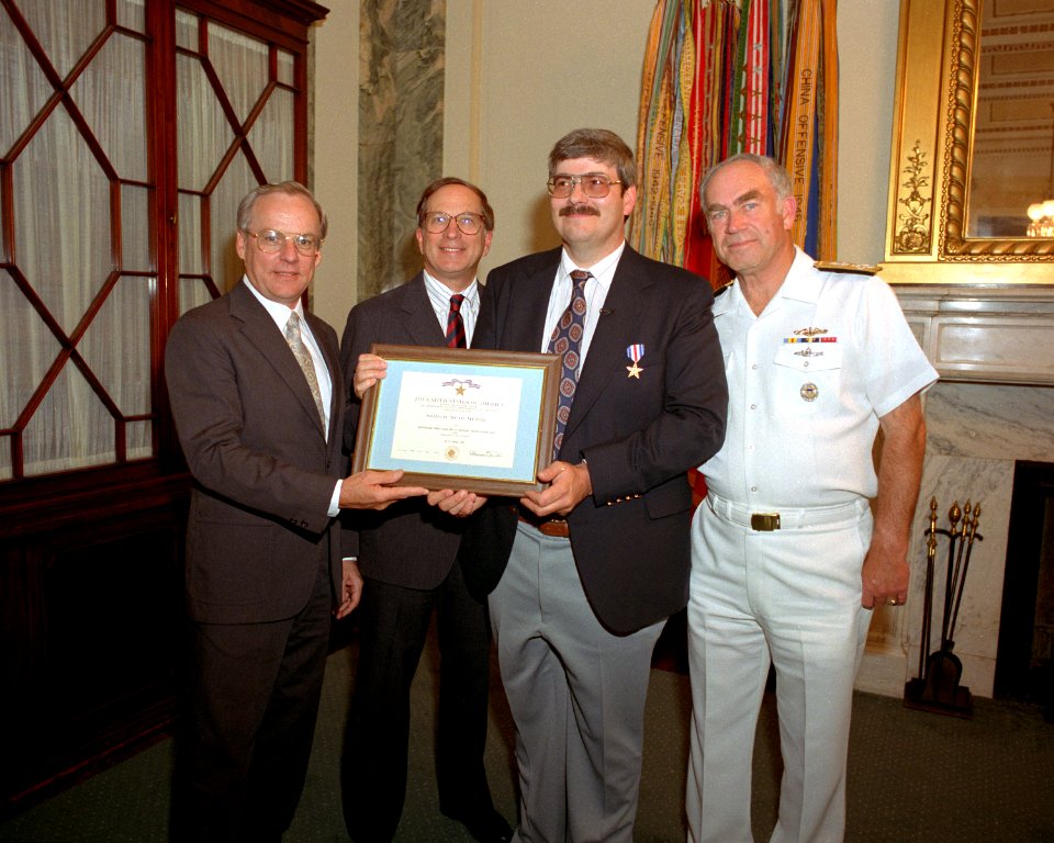 Eric K. Hefright holds his Silver Star Medal citation after a ceremony at the Pentagon