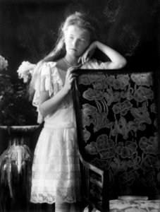 Grand Duchess Olga leaning against chair 1906