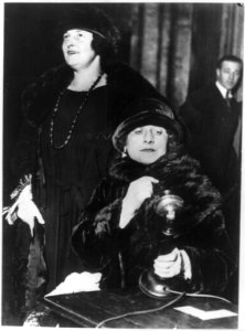 Grand opera by radio inaugurated as regular program of Chicago company. Mary Garden ... listening as Miss Edith Mason, ... sings into the radio transmitter for the first regular radio LCCN2003669869