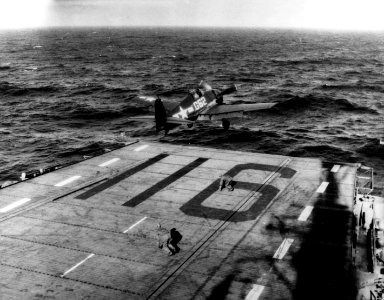 Grumman F6F-5 Hellcat is catapulted from USS Badoeng Strait (CVE-116), circa in early 1946 (NH 95747)