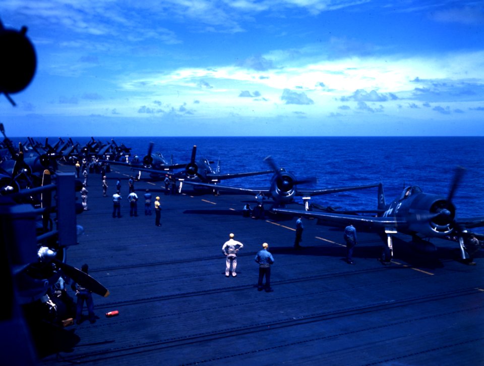 Grumman F6F-3 Hellcats of VF-25 warming up on the flight deck of USS Cowpens (CVL-25), circa January 1944 (80-G-K-100)