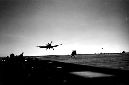 Grumman F6F-3 Hellcat comes in for a landing aboard USS Cowpens (CVL-25), circa in late 1943 (80-G-K-1073)