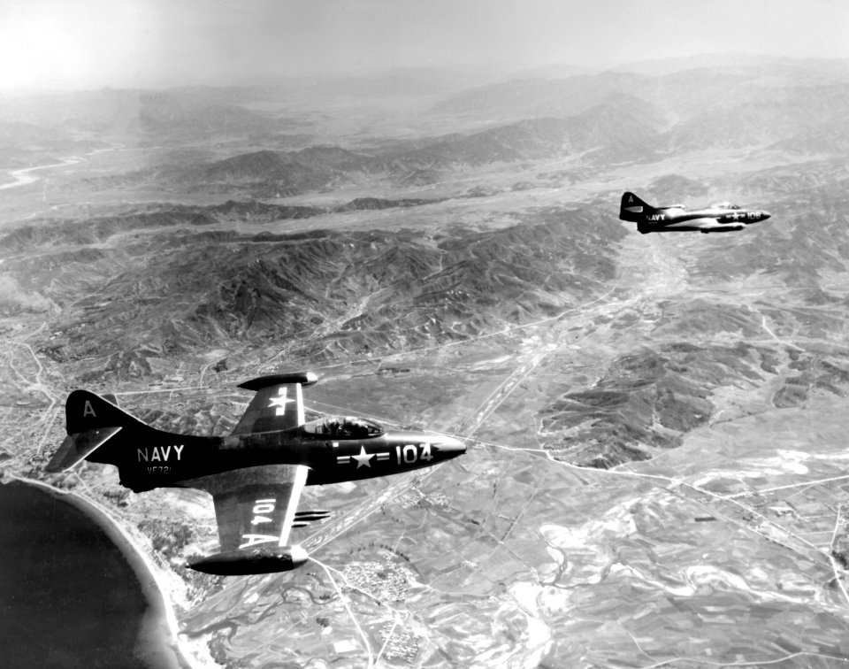 Grumman F9F-2B Panthers of VF-721 in flight over Korea on 15 July 1951 (80-G-431906)