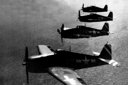 Grumman F6F-5 Hellcats from USS Saidor (CVE-117) in flight, circa in 1946