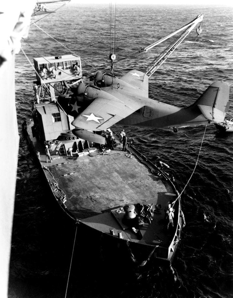 Grumman JRF Goose is hoisted aboard USS Long Island (ACV-1) off Palmyra Island, 19 April 1943 (80-G-66769)