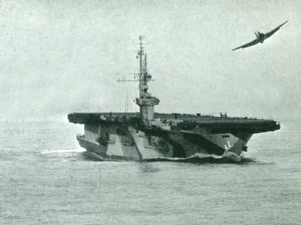 Grumman TBF Avenger of VC-85 flies over USS Lunga Point (CVE-94), in January 1945