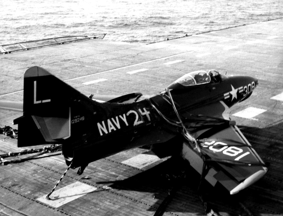 Grumman F9F-6 Cougar of VF-73 after a barrier landing aboard USS Midway (CVA-41) on 12 May 1954 (NNAM.1996.253.7407.003)