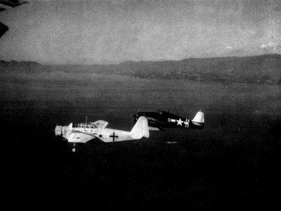 Grumman F6F-5 Hellcat of VF-40 escorts Japanese Kyūshū K11W after the Japanese surrender, in August 1945