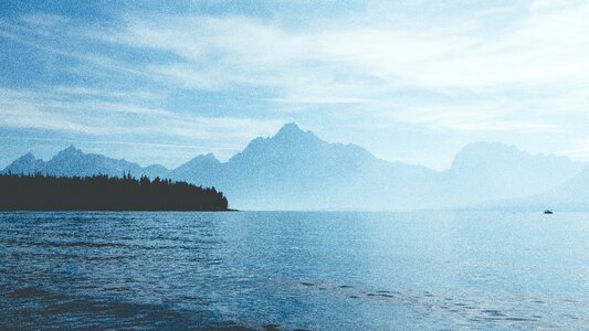 Boat sailing mountain