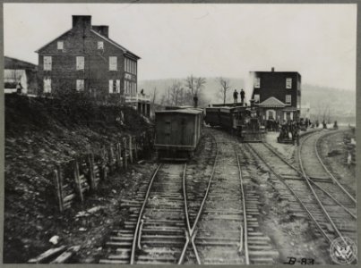 Hanover Junction Pennsylvania, 1863, railroad yards. Detail of tracks, engine, boxcar, and crowd LCCN2012649996
