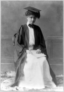 Helen Keller, full length portrait, seated in cap and gown LCCN2016651807 photo