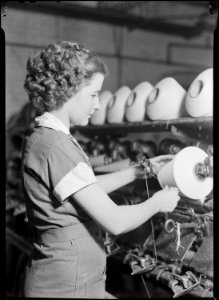 High Point, North Carolina - Textiles. Pickett Yarn Mill. Winder operator - highly skilled - showing hands in... - NARA - 518521 photo