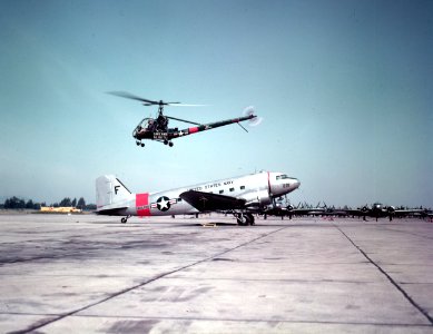 Hiller HTE-2 flies over a Douglas R4D-5 at Naval air Station Oakland, Califronia (USA), on 5 June 1953 (80-G-K-16515)