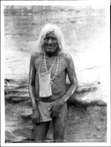 Hopi Priest with bag of sacred meal for the Flute Dance Ceremony at the pueblo of Walpi, Arizona, ca.1898 (CHS-4644)