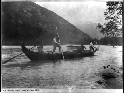 Indians poling canoe up Dyea River LCCN2016653515 photo