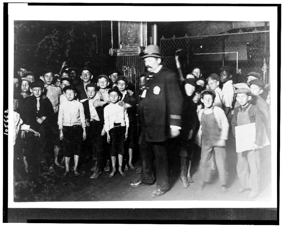 Indianapolis Newsboys Waiting for the Base-ball Edition In a Newspaper Office. Aug., 1908. Wit., E. N. Clopper. LOC cph.3c05662