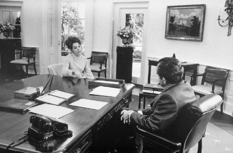 Julie Eisenhower talking to Richard M. Nixon in the oval office. - NARA - 194745 photo
