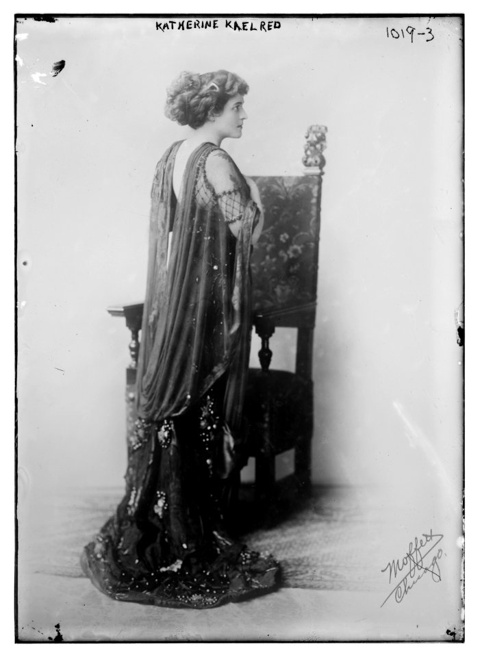 Katherine Kaelred standing before chair, Moffett Studio in Chicago - Moffett Studio LCCN2014684757