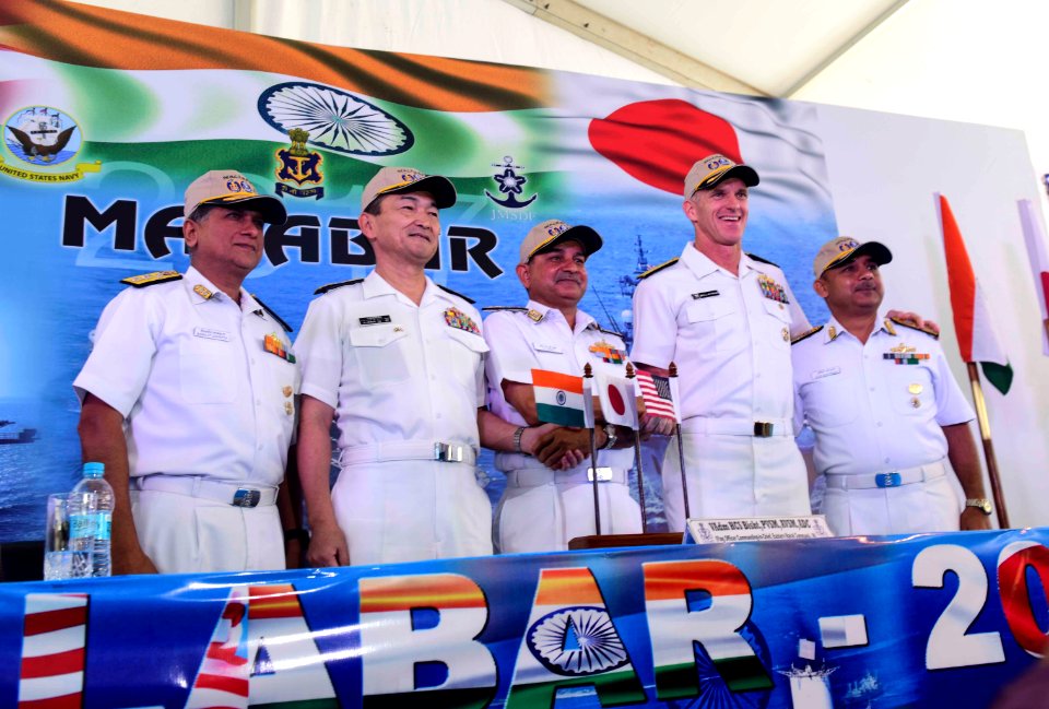 Leaders from the U.S., Indian, and Japanese maritime forces pose for a photo after a press conference aboard the INS Jalashwa (LPD 41) following the opening ceremonies of exercise Malabar 2017