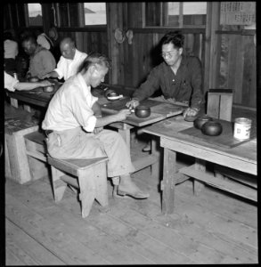 Manzanar Relocation Center, Manzanar, California. Playing the Japanese game Goh in the Relocation H . . . - NARA - 538077