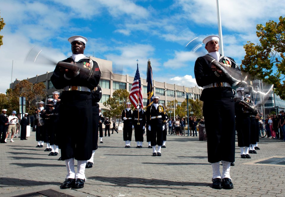 Marines and sailors participate in half-time ceremony during NFL game 121006-N-PB383-678
