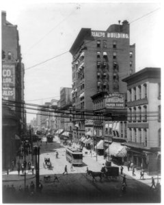 Mo. St. Louis - 4th St. north from Planters' Hotel; busy street scene showing pushcarts, carriages, delivery wagons, and trolleys LCCN2007682269
