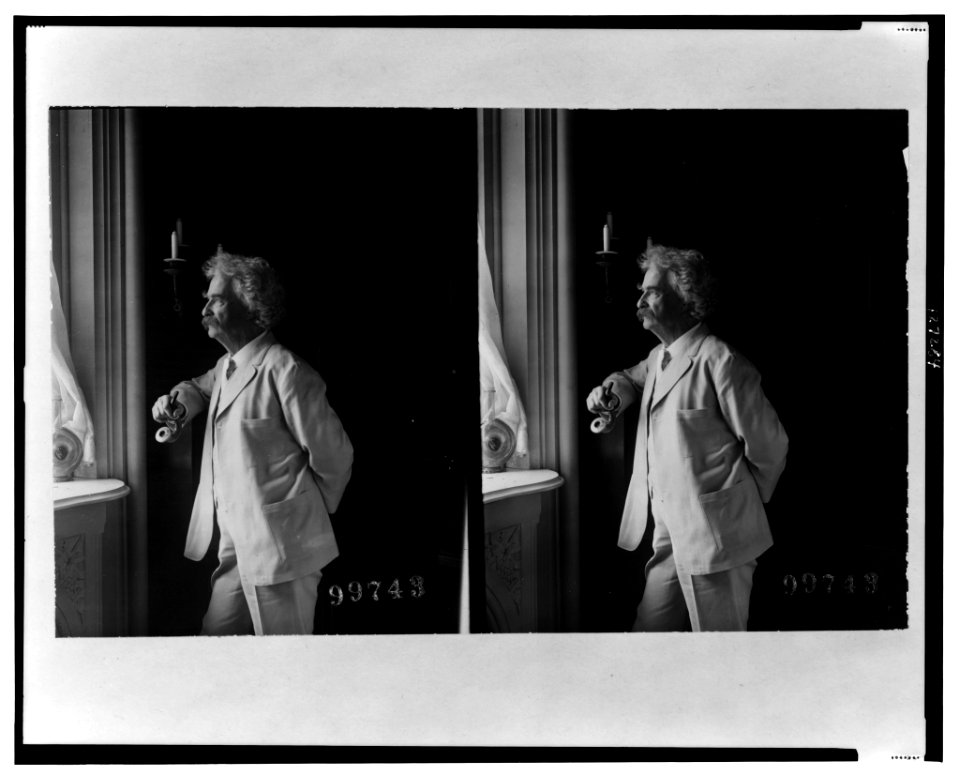 Mark Twain (Samuel Langhorne Clemens), three-quarter length portrait, standing by window, facing left LCCN00652751