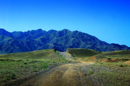 The dirt road mountain blue sky