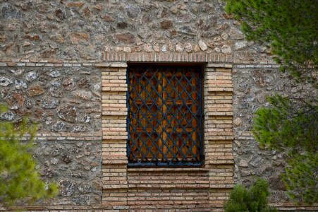 Wrought iron wall stone grid photo