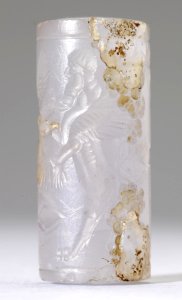 Mesopotamian - Cylinder Seal with Genius and Human-Headed Lions - Walters 42666 - Side A photo