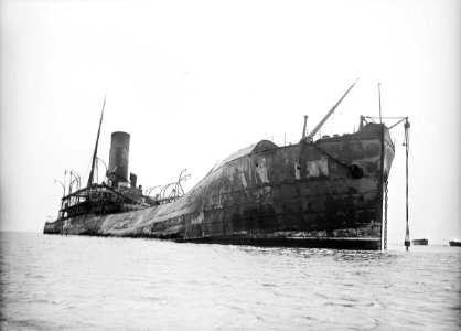 Papanui (1898) abandoned as a burnt out wreck off St Helena. RMG P00836 photo
