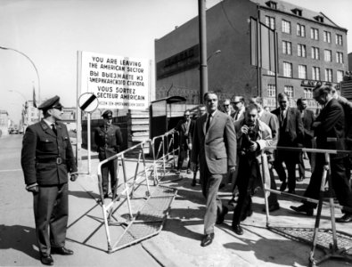 Peace Corps Director Sargent Shriver inspects Checkpoint Charlie during his visit to Berlin on April 26,1964 - 034 490-D-6-003