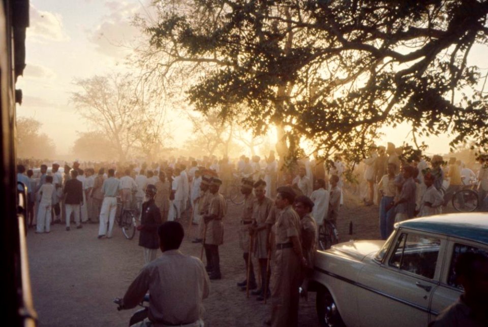 People waiting at an unidentified train station, during First Lady Jacqueline Kennedy’s trip to India