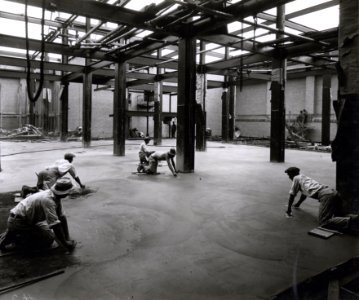 Photograph of Workers Finishing the Floor of a Stack Area in the National Archives Building (35262799153) photo